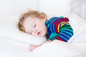 sleep children world Cute sleeping toddler girl in a white bed