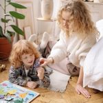 Mother and son completing a puzzle together